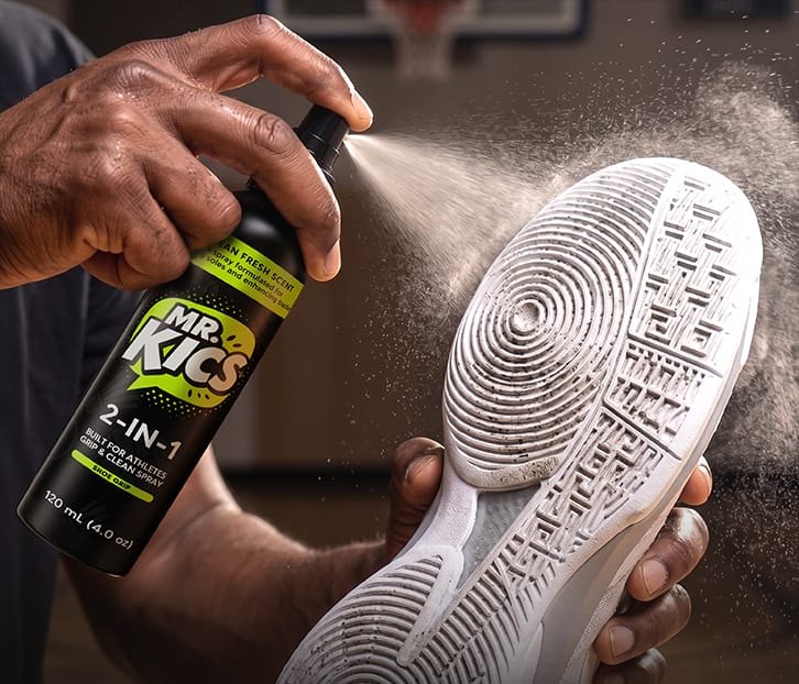 Spraying the sole of a shoe